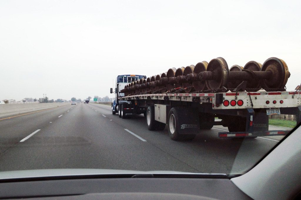 flatbed truck with load on road