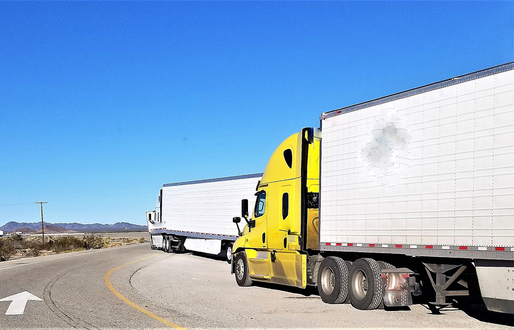 yellow dry van truck on road FTL