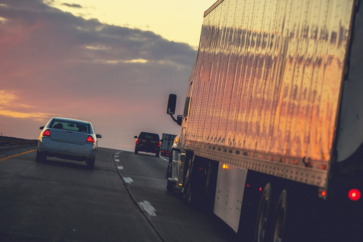 Truck Delivery on the Way. Semi Truck on a Highway.