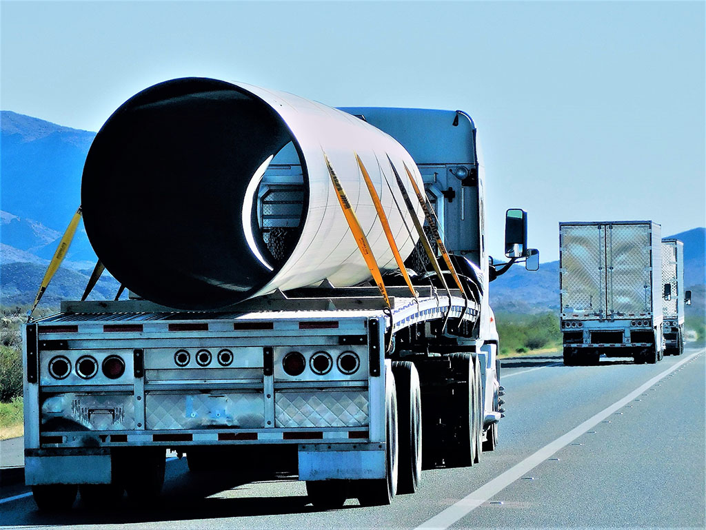 trucking hauling pipe 